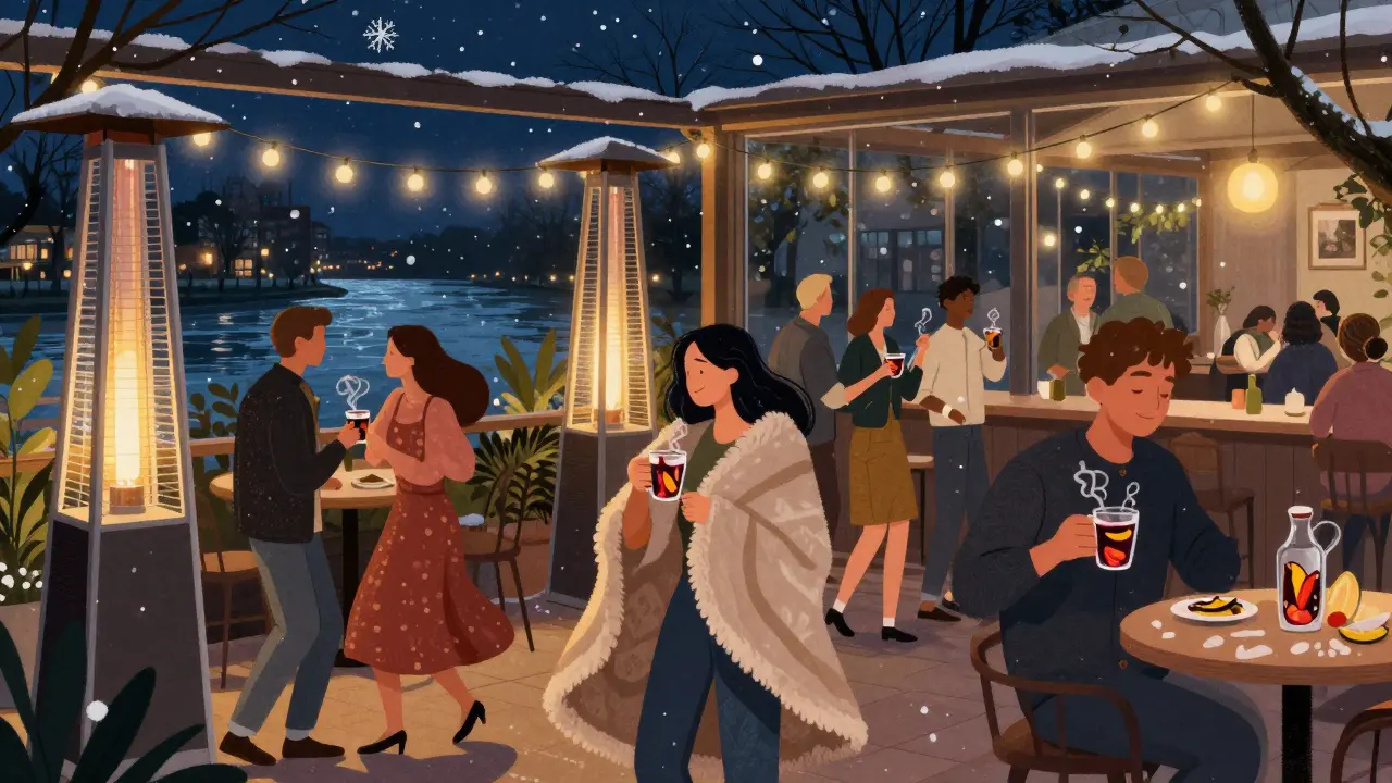 People dancing in Pacha Munich&#039;s heated outdoor garden with blankets, mulled wine, and snow falling softly.