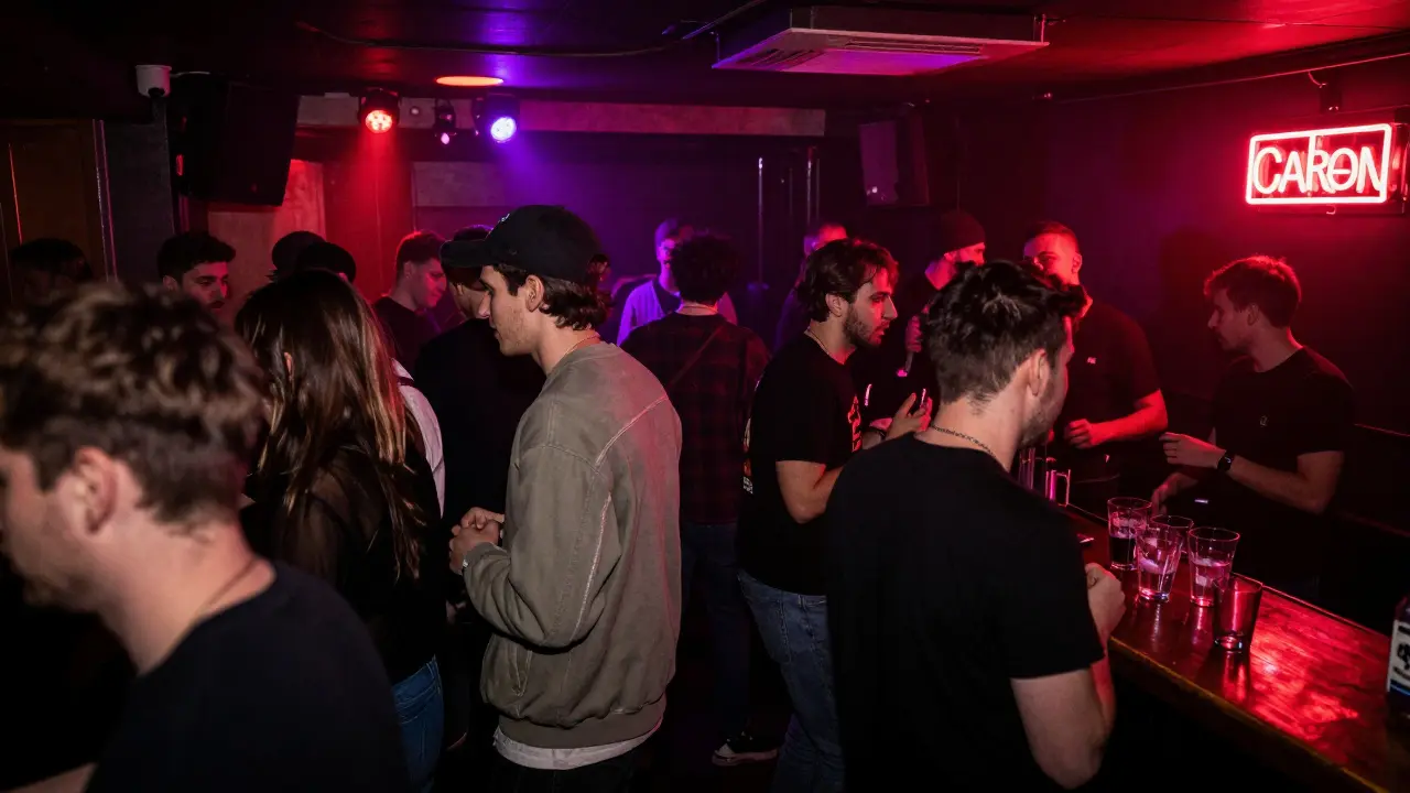 Crowded underground club The Cross with bass-heavy music, red and purple lights, and energetic crowd.