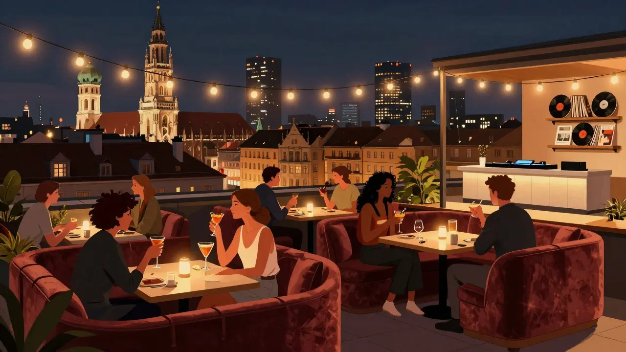 People relaxing on a rooftop lounge with Munich’s skyline glowing behind them at night.